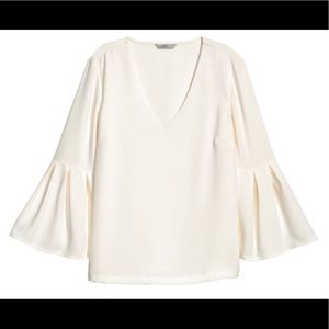 White V-neck bell-sleeved blouse